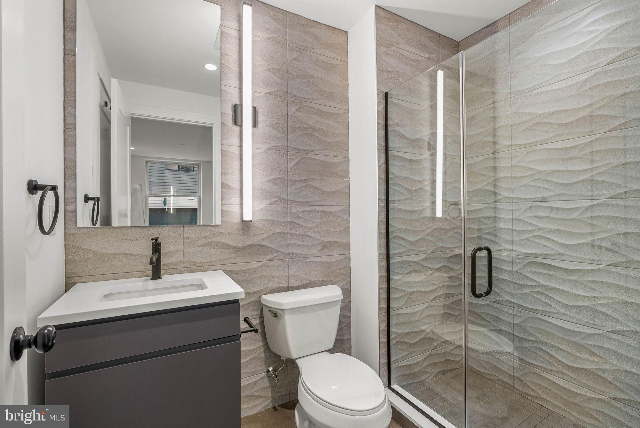 650 Fairmount Avenue, Unit A2 Philadelphia, PA 19123 - Photo 24 of 40 a bathroom with a toilet sink and shower