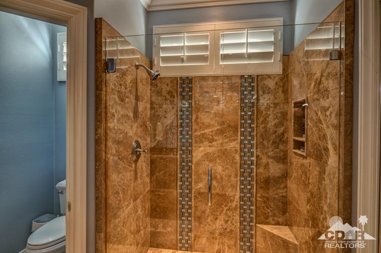 78632 Rainswept Way Palm Desert, CA 92211 - Photo 13 of 20 a bathroom with a shower and a toilet