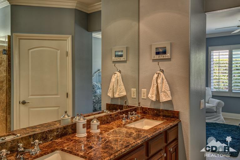78632 Rainswept Way Palm Desert, CA 92211 - Photo 14 of 20 a room with a table chairs and a wooden floor