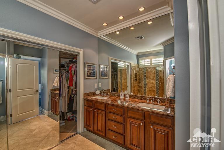 78632 Rainswept Way Palm Desert, CA 92211 - Photo 15 of 20 a bathroom with a double vanity sink and a mirror