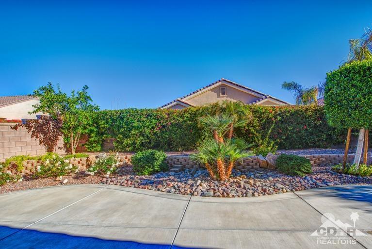 78632 Rainswept Way Palm Desert, CA 92211 - Photo 18 of 20 a front view of a house with a garden