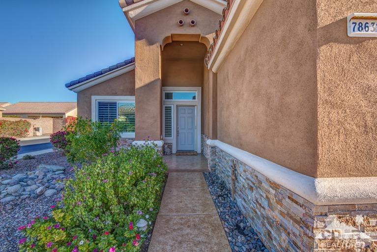 78632 Rainswept Way Palm Desert, CA 92211 - Photo 3 of 20 a view of a brick house with a small yard