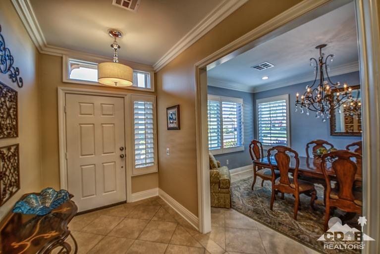 78632 Rainswept Way Palm Desert, CA 92211 - Photo 10 of 20 a view of a dining room with furniture and chandelier