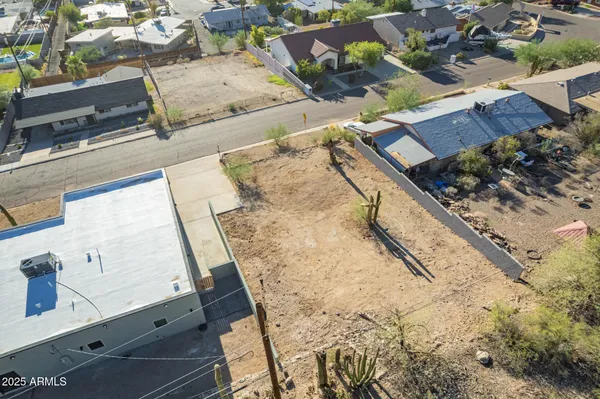 an aerial view of residential house with wooden stairs