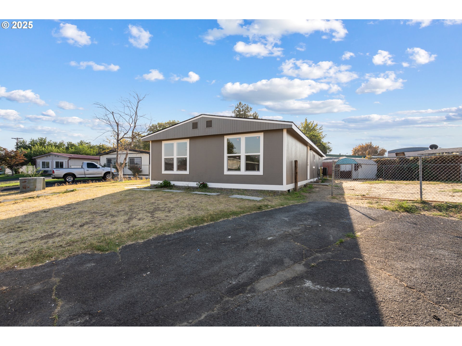 1175 Southwest Sandy Drive Hermiston, OR 97838 - Photo 1 of 30 a view of a house with a yard