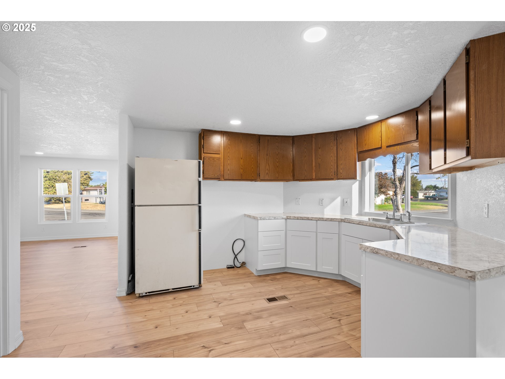 1175 Southwest Sandy Drive Hermiston, OR 97838 - Photo 13 of 30 a kitchen with a sink cabinets and appliances