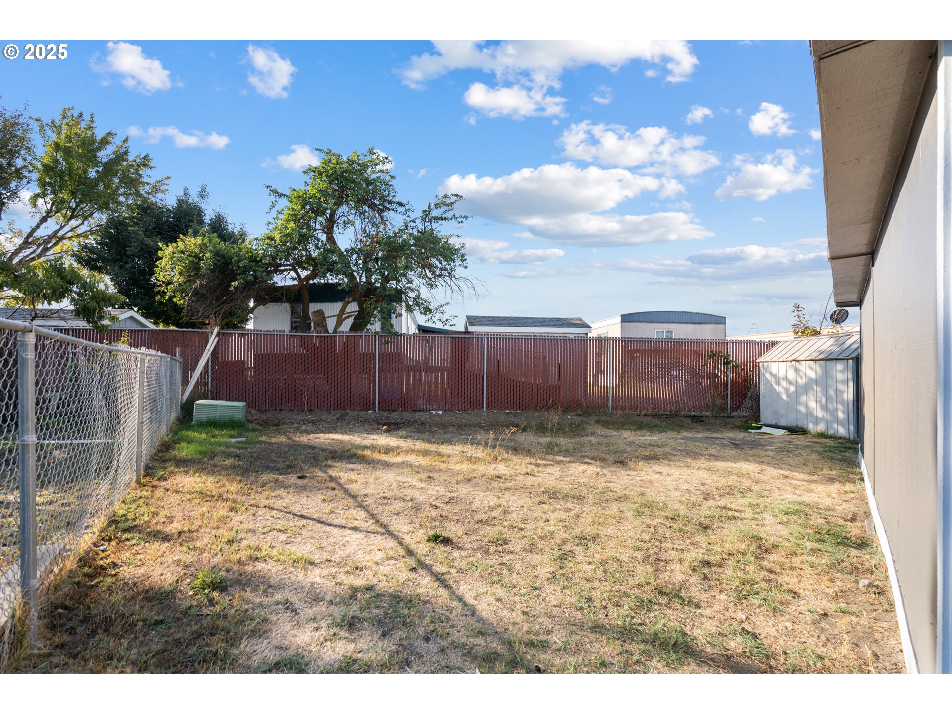 1175 Southwest Sandy Drive Hermiston, OR 97838 - Photo 26 of 30 a view of a backyard