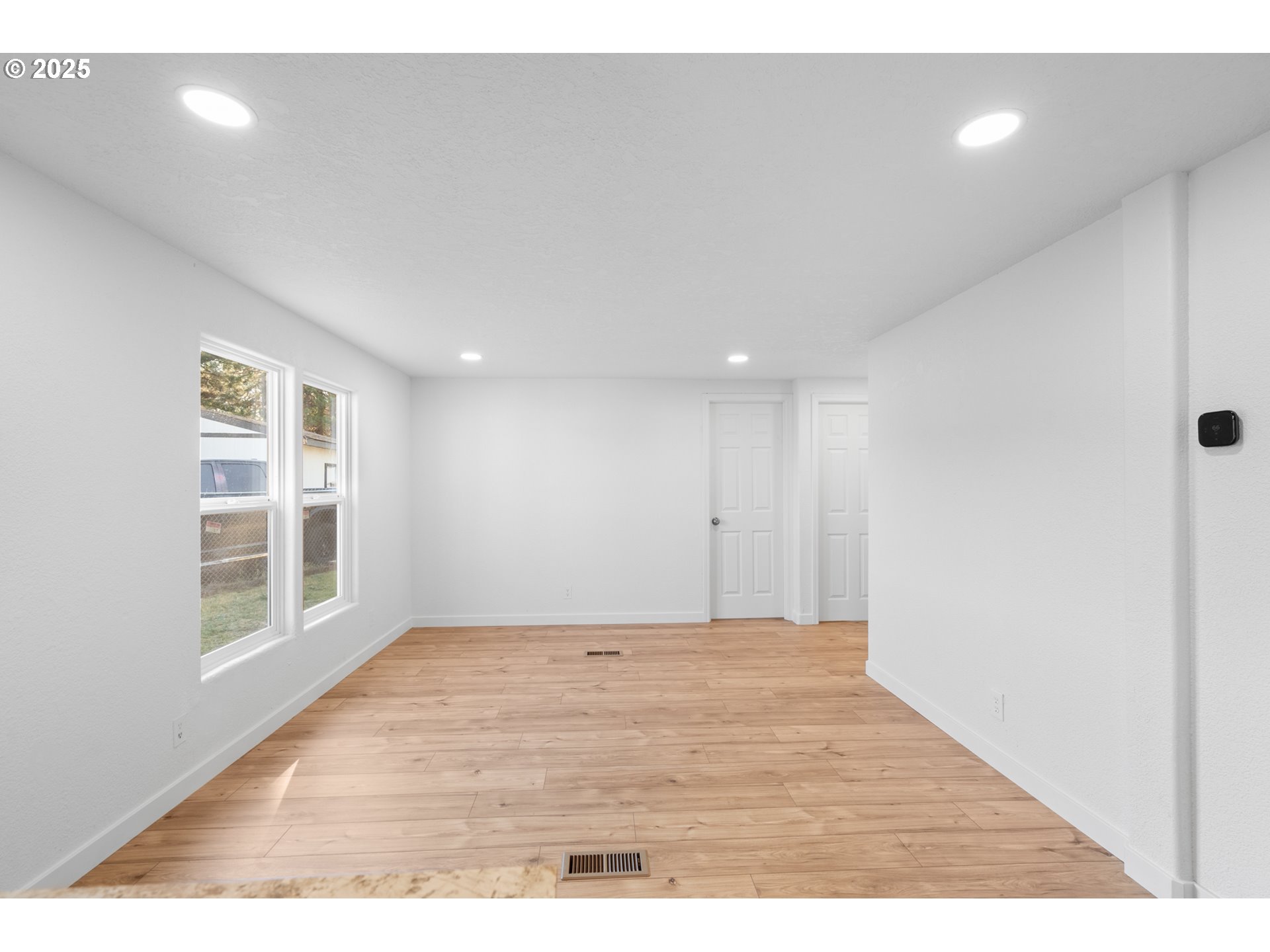 1175 Southwest Sandy Drive Hermiston, OR 97838 - Photo 7 of 30 a view of an empty room with a window