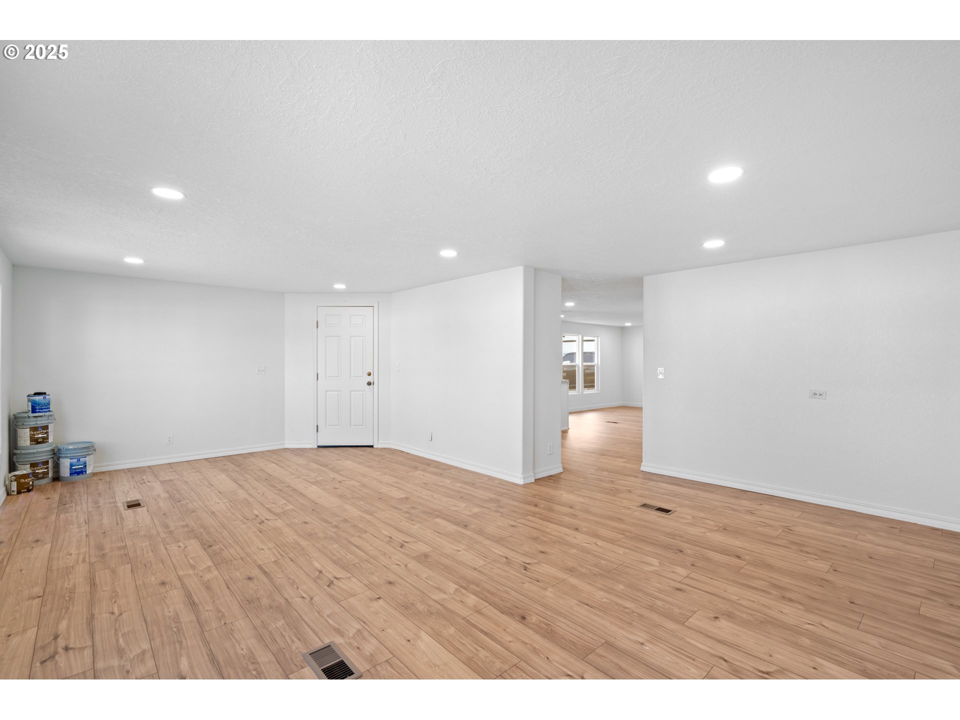 1175 Southwest Sandy Drive Hermiston, OR 97838 - Photo 9 of 30 a view of an empty room with wooden floor