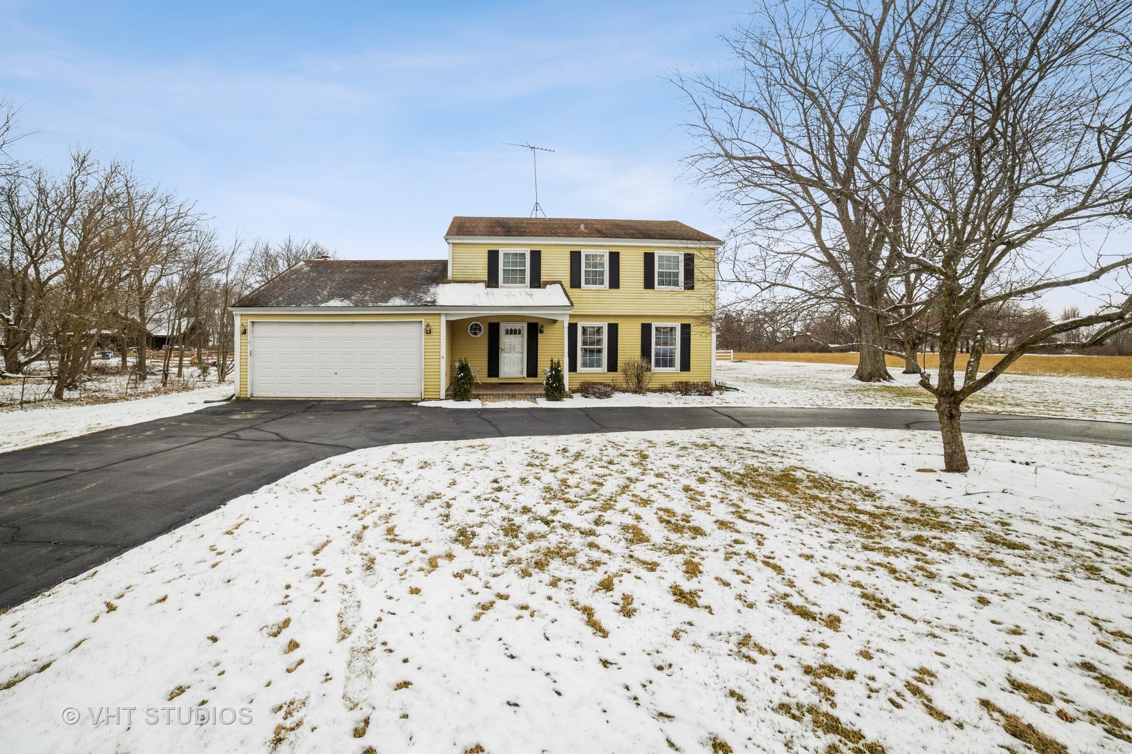 43-w043 Campton Hills Road Elburn, IL 60119 - Photo 1 of 22 a front view of a house with a yard