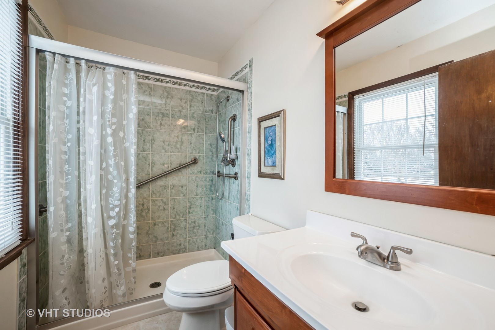 43-w043 Campton Hills Road Elburn, IL 60119 - Photo 16 of 22 a bathroom with a sink toilet and shower