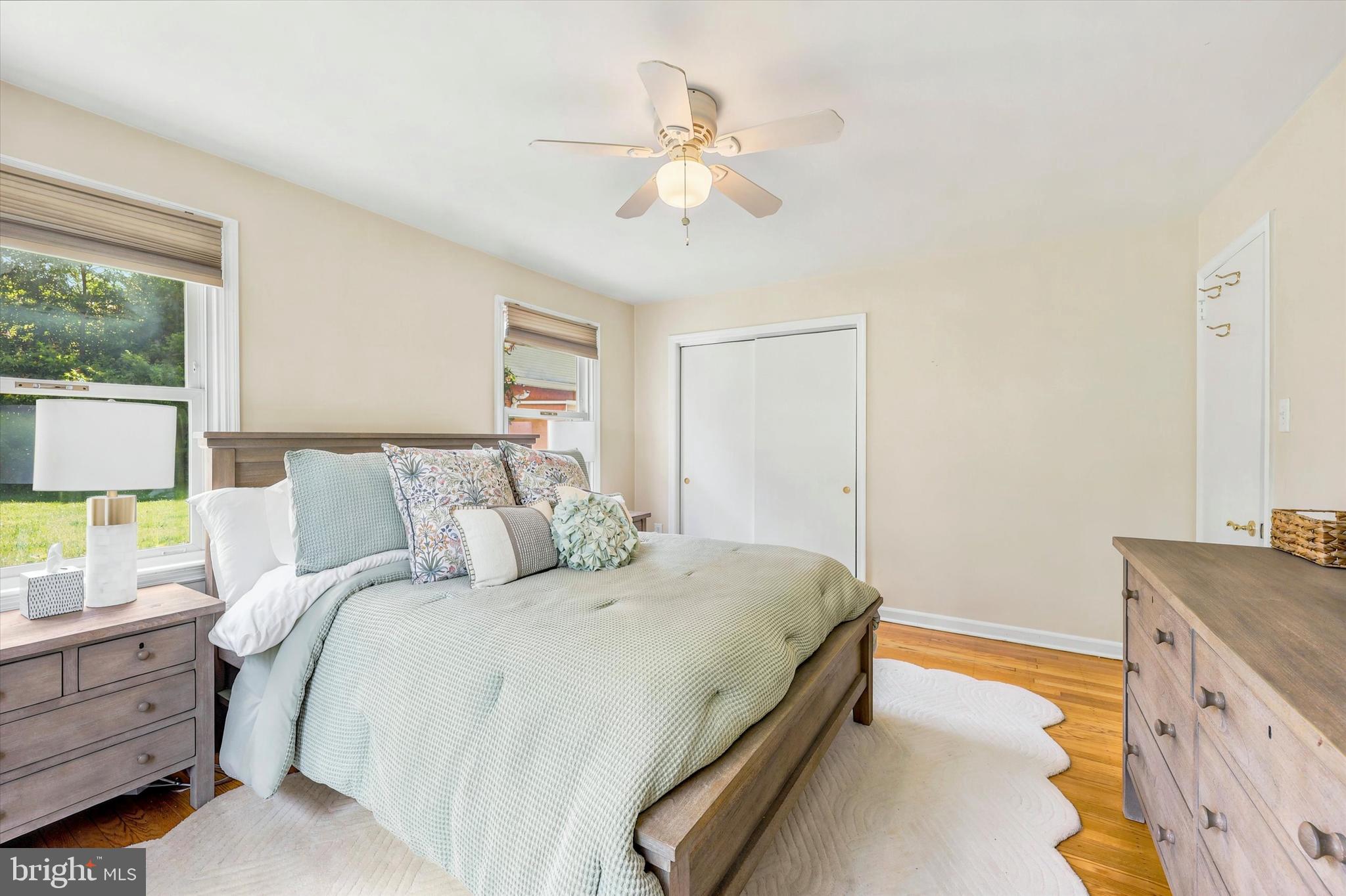 39 Haverford Road Ardmore, PA 19003 - Photo 13 of 24 a bed room with a bed and a chandelier
