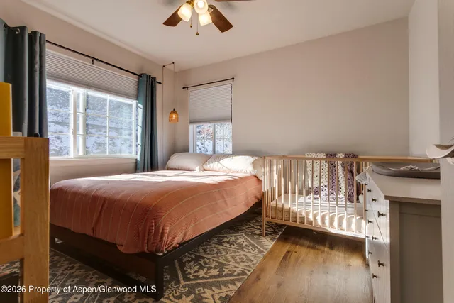 a bedroom with a bed and a fireplace