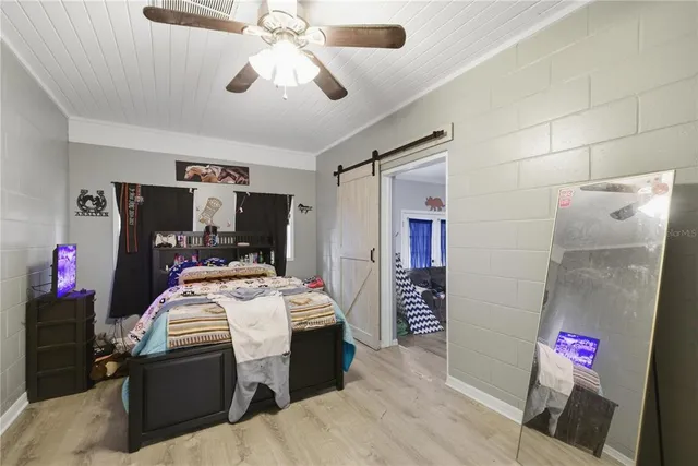 a view of walk in closet with clothes
