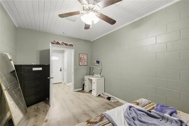 a bed room with furniture and a window