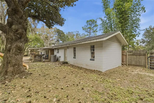 a house with trees in the background