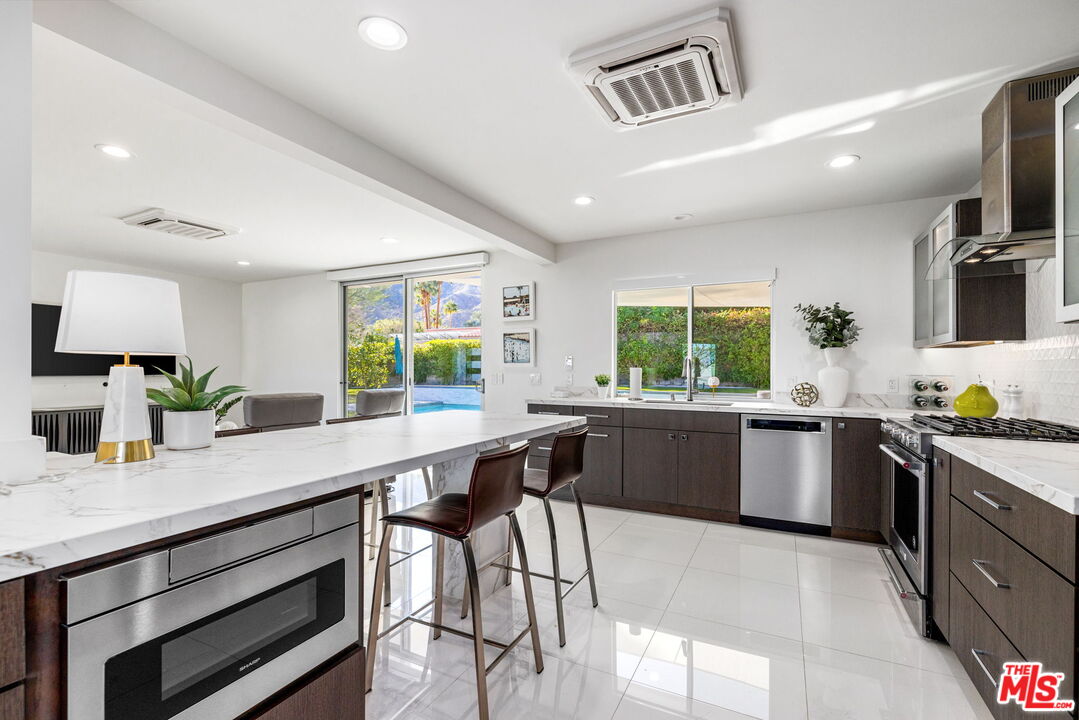 71581 Halgar Road Rancho Mirage, CA 92270 - Photo 14 of 39 a kitchen with a window appliances and cabinets