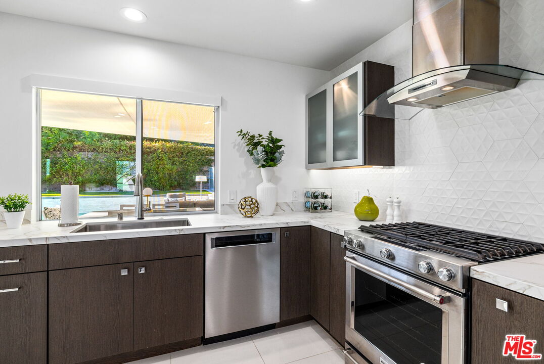 71581 Halgar Road Rancho Mirage, CA 92270 - Photo 16 of 39 a kitchen with a sink and a window