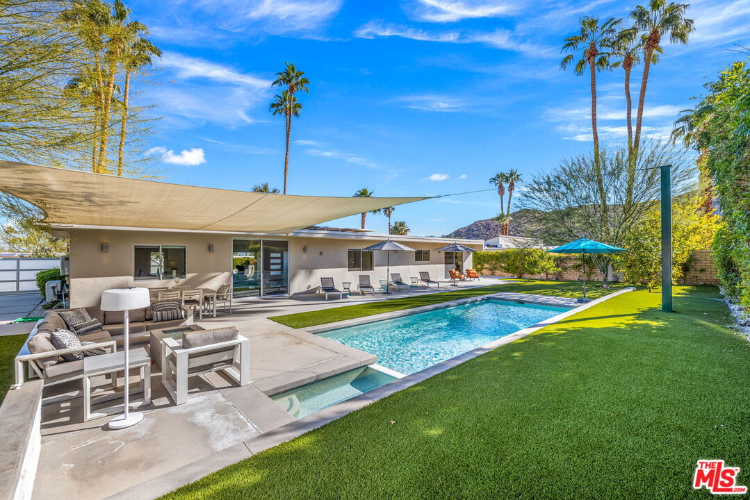 71581 Halgar Road Rancho Mirage, CA 92270 - Photo 30 of 39 a view of a house with swimming pool and sitting area