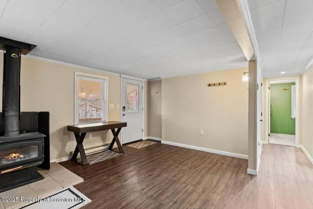 a view of a livingroom with furniture and a flat screen tv