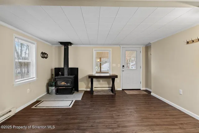 a living room with furniture a fireplace and a table