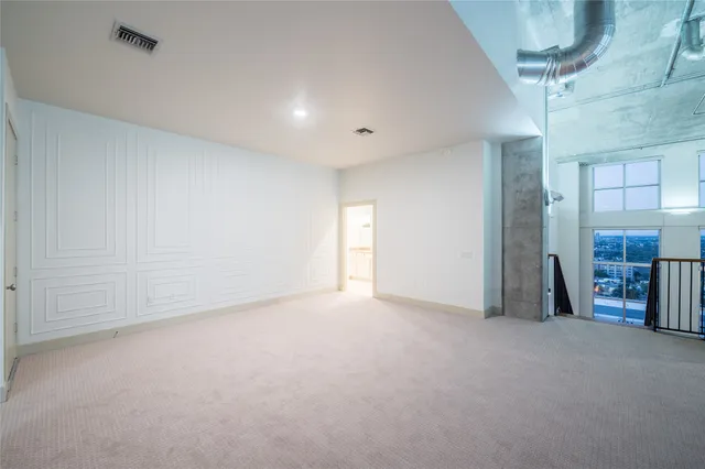 a view of an empty room with a fireplace