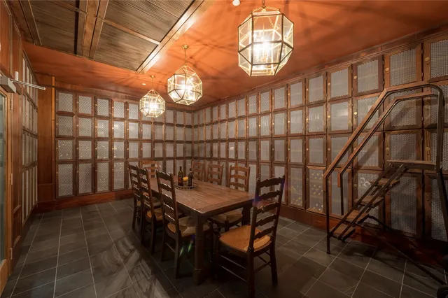 a view of a dining room with furniture and a chandelier