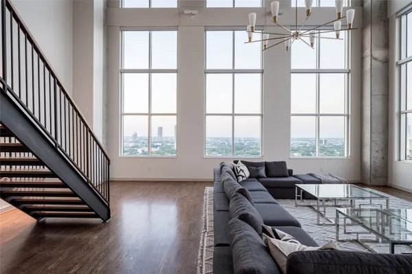 a living room with furniture and a window