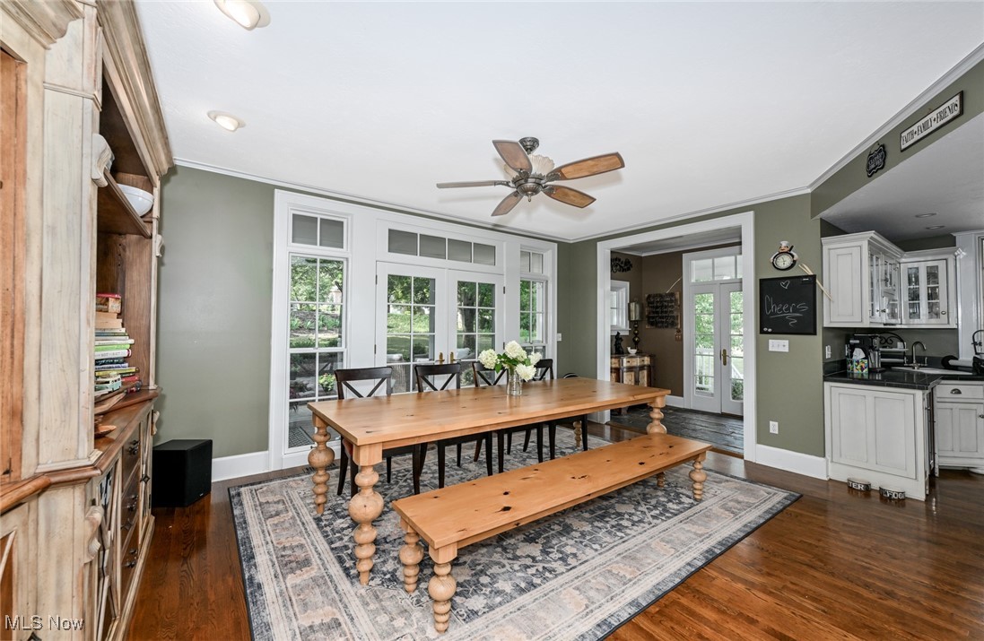 8960 Avery Road Broadview Heights, OH 44147 - Photo 11 of 50 Dining area featuring dark hardwood / wood-style flooring, ornamental molding, french doors, and ceiling fan