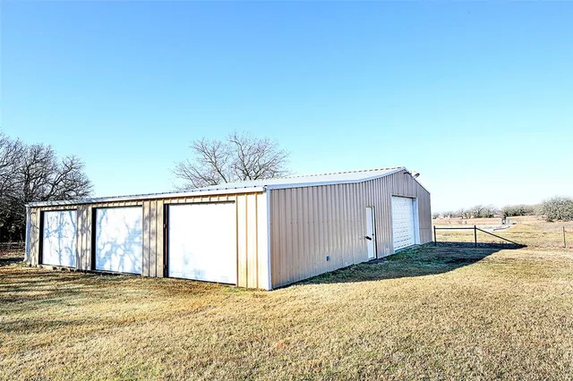 a view of a backyard of a house