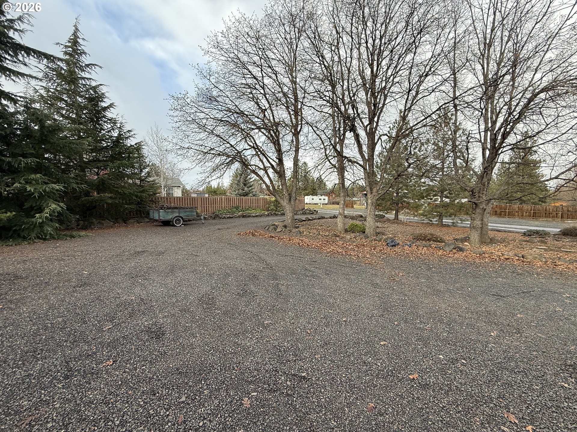 110 South Mike Road Tygh Valley, OR 97063 - Photo 14 of 42 a view of dirt field with trees in the background