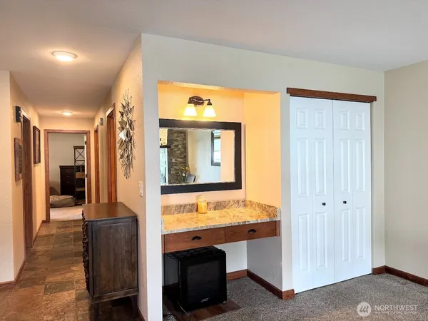 a spacious bedroom with a bed and window