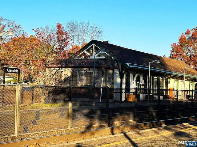 a view of a swimming pool with outdoor seating