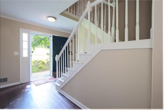 26 Flint Ridge Drive Southeast Mableton, GA 30126 - Photo 13 of 28 a view of staircase with wooden floor and a window