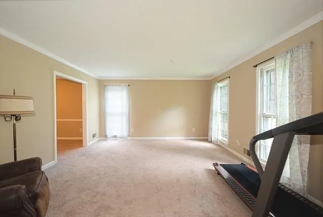 a view of an empty room with a window