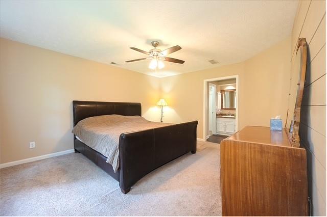 26 Flint Ridge Drive Southeast Mableton, GA 30126 - Photo 19 of 28 a bedroom with a bed dresser and a window