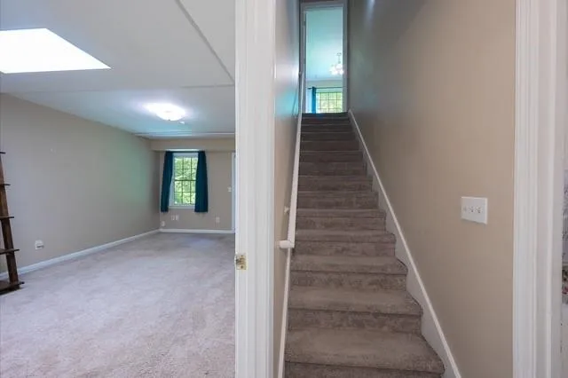 a view of a hallway with stairs