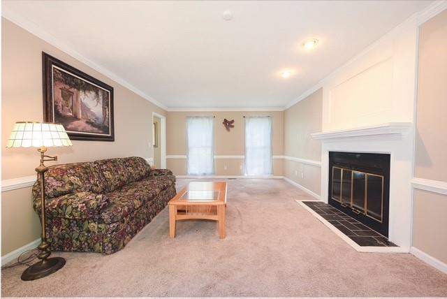 26 Flint Ridge Drive Southeast Mableton, GA 30126 - Photo 6 of 28 a living room with furniture and a fireplace