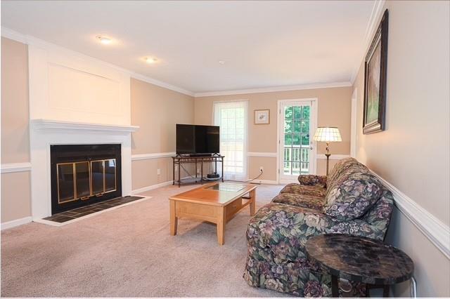 26 Flint Ridge Drive Southeast Mableton, GA 30126 - Photo 7 of 28 a living room with furniture flat screen tv and a fireplace
