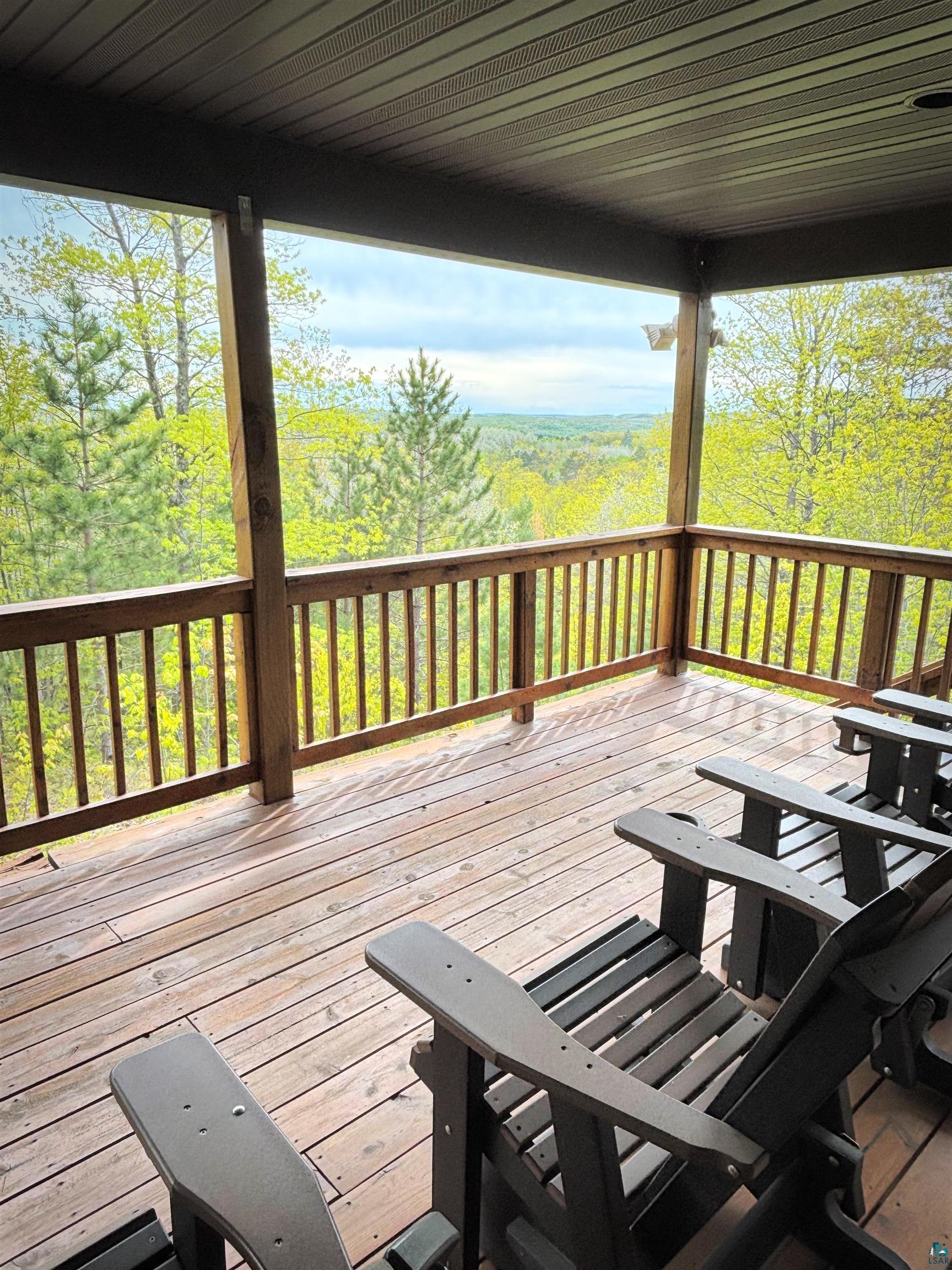 28255 Friendly Valley Road Washburn, WI 54891 - Photo 19 of 34 Wooden terrace featuring a view of trees