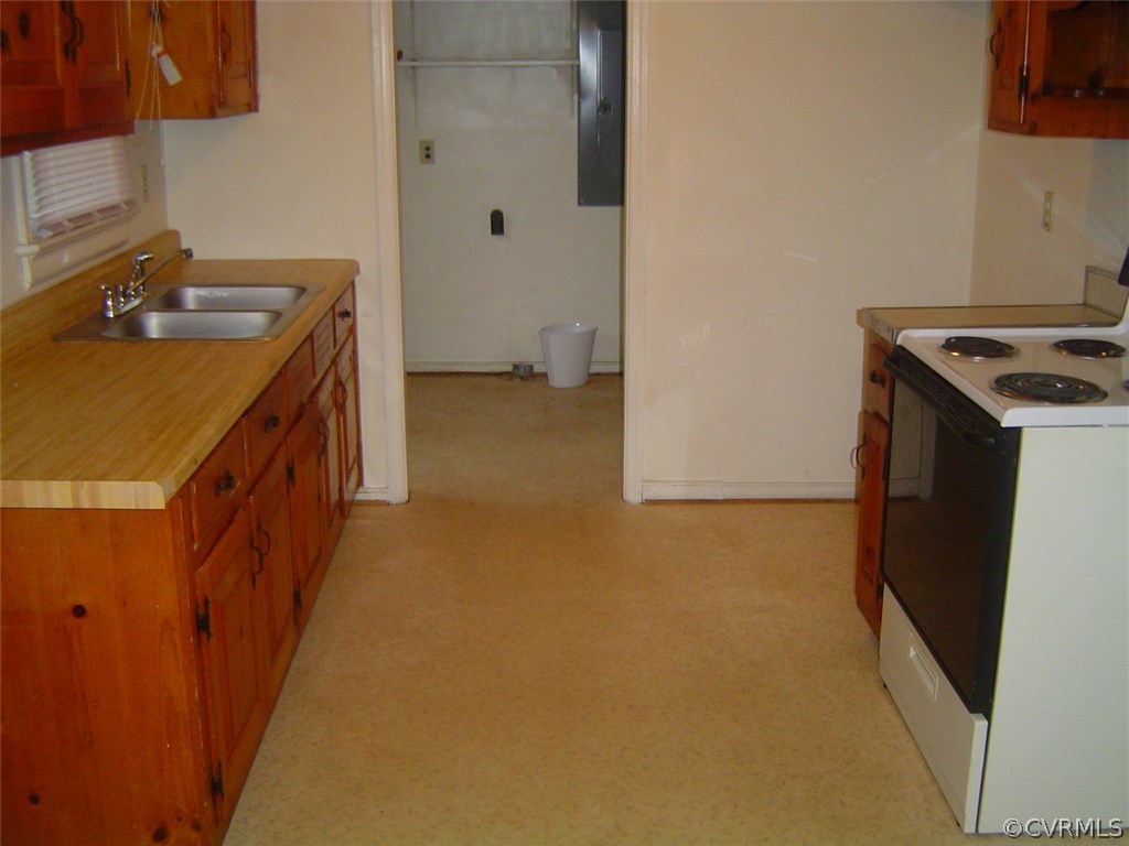 7625 Ponce De Leon Road North Chesterfield, VA 23237 - Photo 3 of 7 a utility room with a sink a washer and dryer