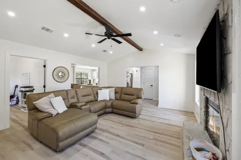 a kitchen with stainless steel appliances a stove microwave and cabinets