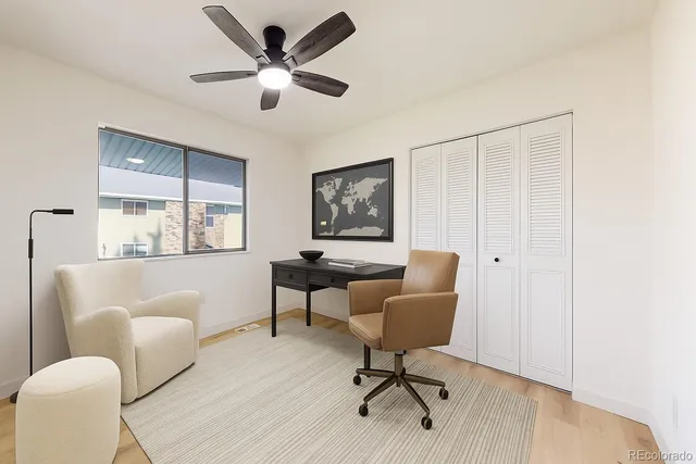 a work room with furniture and windows