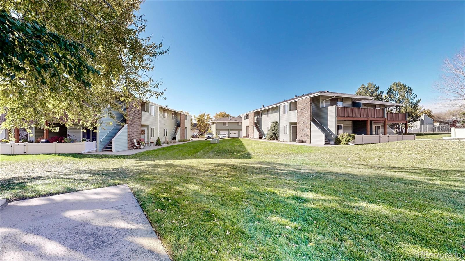 1800 Ionic Drive, Unit C Lafayette, CO 80026 - Photo 17 of 19 a view of a house with a yard