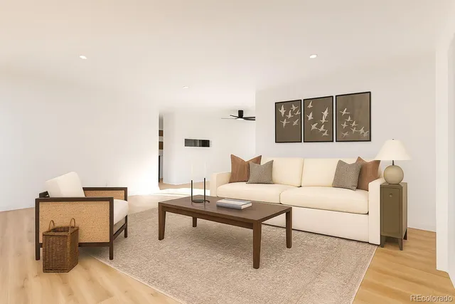 a living room with furniture and a rug