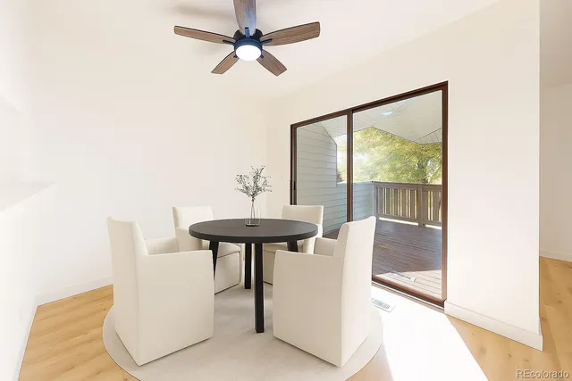 a view of a livingroom with furniture and a window
