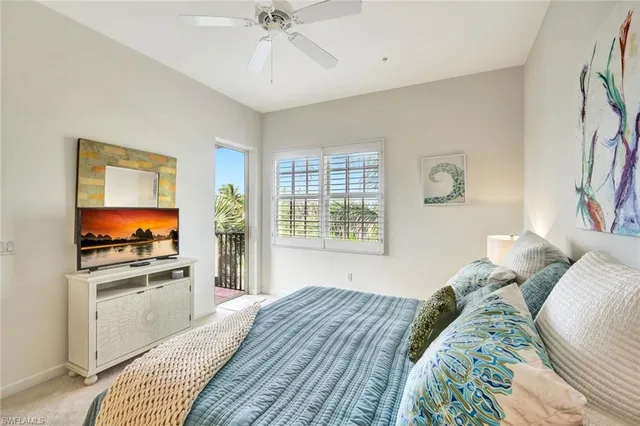 a bed room with a bed and a television