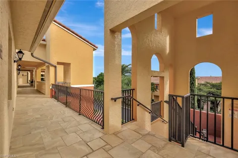 a view of a house with wooden fence