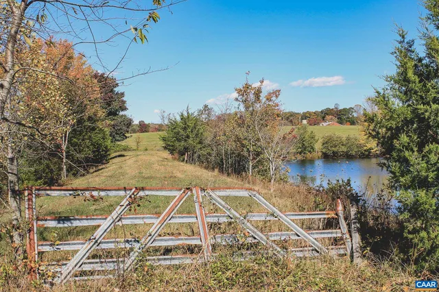 a view of a swimming pool with a lake view