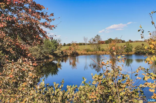 a view of a lake with a building in the background
